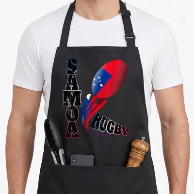 Samoa distressed apron - Vertical SAMOA text beside flag-patterned rugby ball with red blue black white swoosh leading — shown on a black cotton canvas apron against a white background