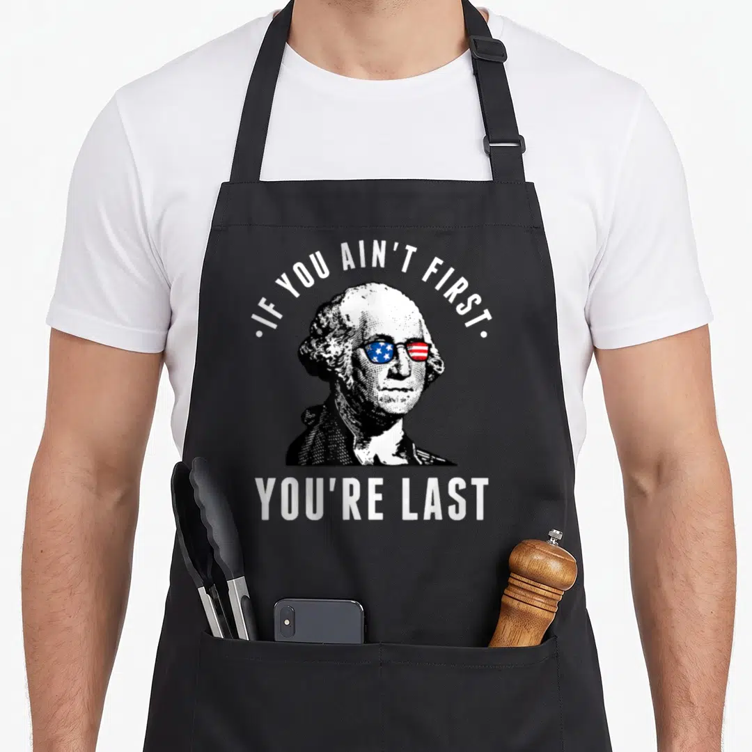 Vintage independence 4th of july apron - Distressed George Washington portrait with sunglasses and arched text IF YOU — shown on a black cotton canvas apron against a white background