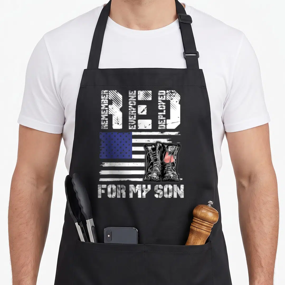 Friday dad and son aprons - Distressed RED acronym with military boots and USA flag design — shown on a black cotton canvas apron against a white background