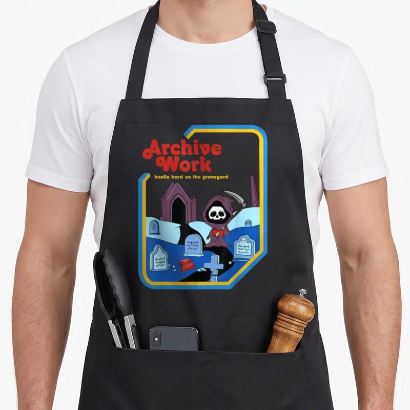 Archive hustle culture apron - Cartoon Grim Reaper in graveyard holding red book and scythe, surrounded by tombstones — shown on a black cotton canvas apron against a white background