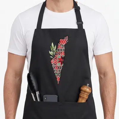 Map palestine apron - Map silhouette filled with red and green embroidery pattern overlapped by an olive branch — shown on a black cotton canvas apron against a white background