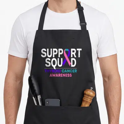 Support thyroid apron - Vertical ribbon in teal pink and purple overlapping white SUPPORT SQUAD text with distressed — shown on a black cotton canvas apron against a white background