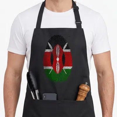 Flag fingerprint kenyan boy apron - Fingerprint shape filled with Kenyan flag colors and a central shield with crossed — shown on a black cotton canvas apron against a white background
