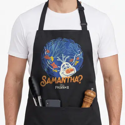Samantha frozen apron - Olaf head in blue circle with falling leaves and orange SAMANTHA text below — shown on a black cotton canvas apron against a white background