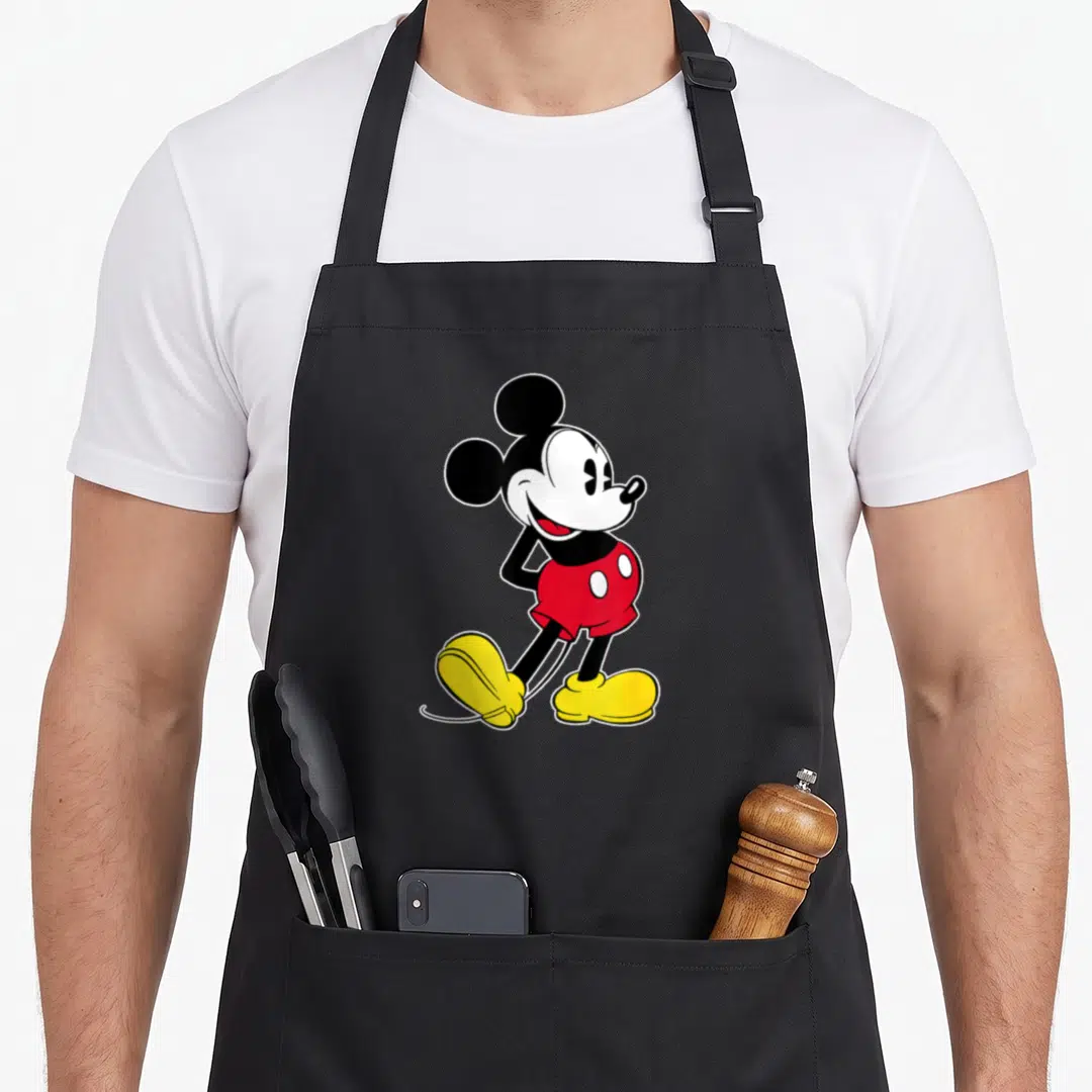 Funny pose mouse dad apron - Centered cartoon mouse in black white red and yellow standing pose — shown on a black cotton canvas apron against a white background