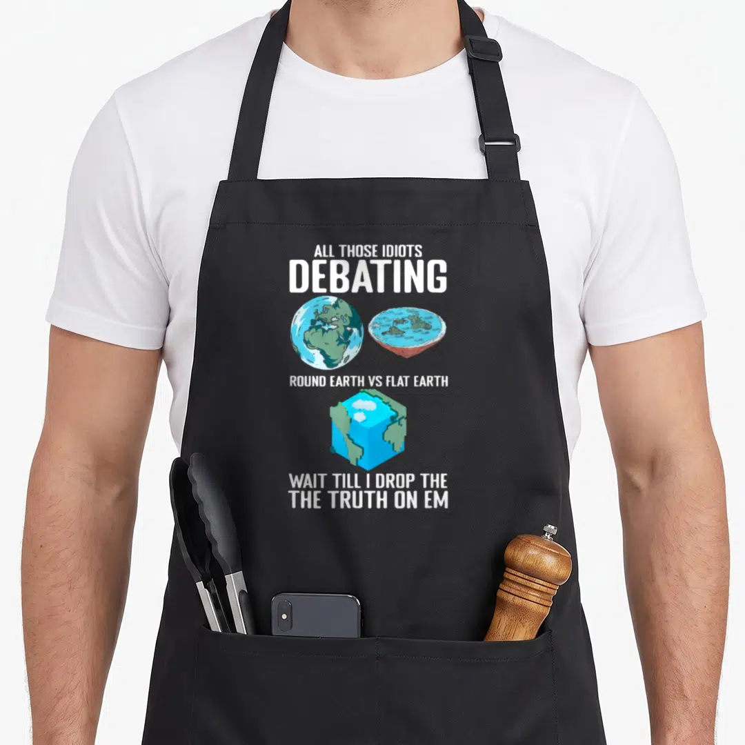Cube science apron - Blue green cube earth graphic with white debating text on black bib — shown on a black cotton canvas apron against a white background