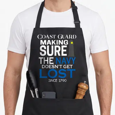 Coast making aprons - Stacked text reading Coast Guard Making Sure The Navy Doesn't Get Lost Since 1790 with a grey — shown on a black cotton canvas apron against a white background