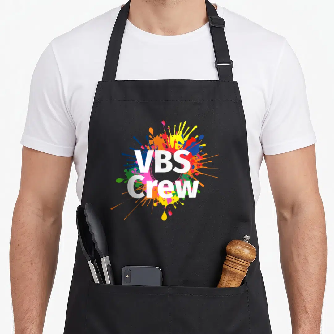 Vbs paint splatter apron - VBS Crew white text over colorful paint splash design — shown on a black cotton canvas apron against a white background