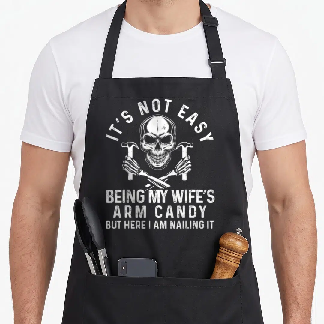 Easy wife father day apron - White skull with crossed skeleton arms holding hammers and distressed text — shown on a black cotton canvas apron against a white background