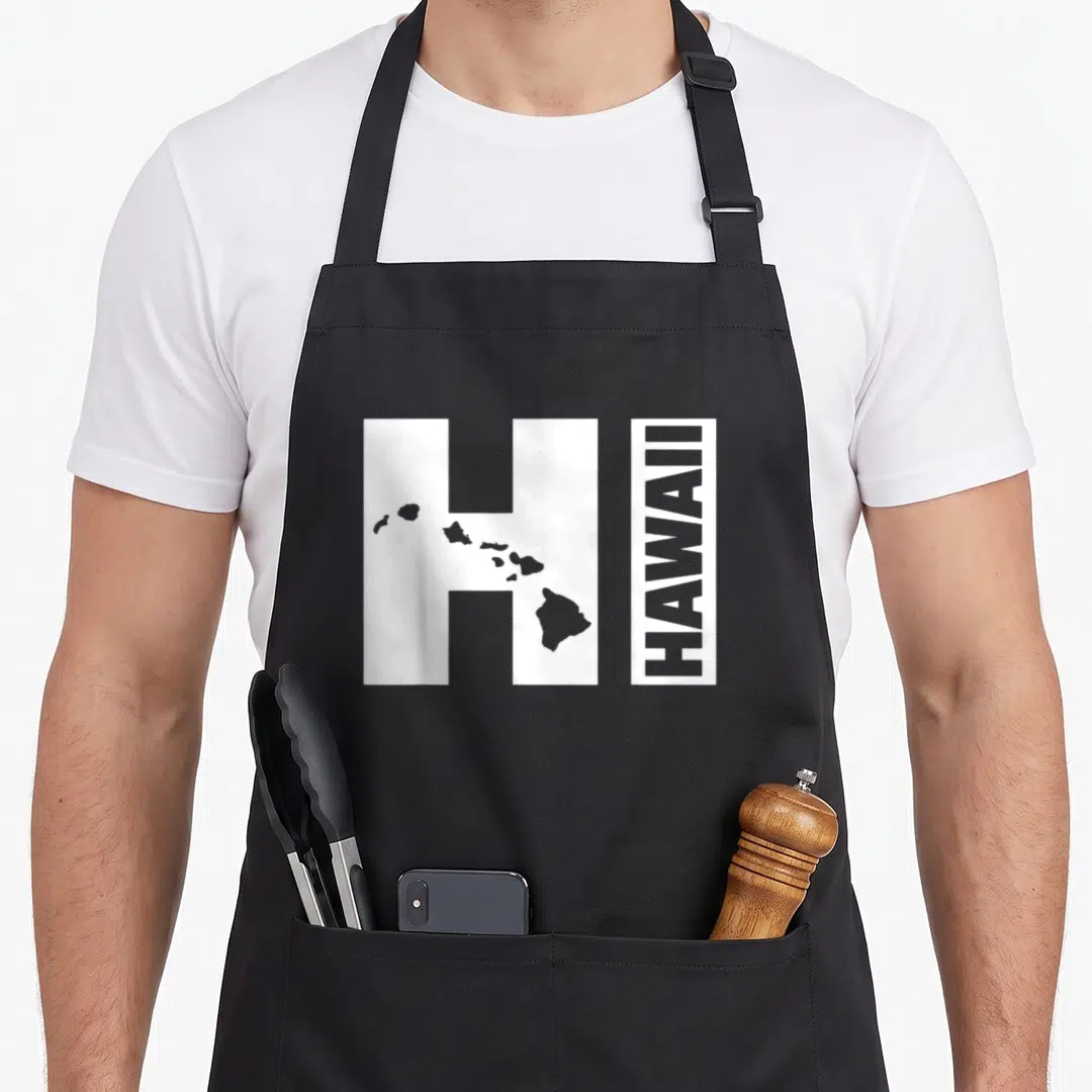 Hawaii island hawaiian apron - White letter H with grey Hawaiian islands silhouette and vertical HAWAII text — shown on a black cotton canvas apron against a white background