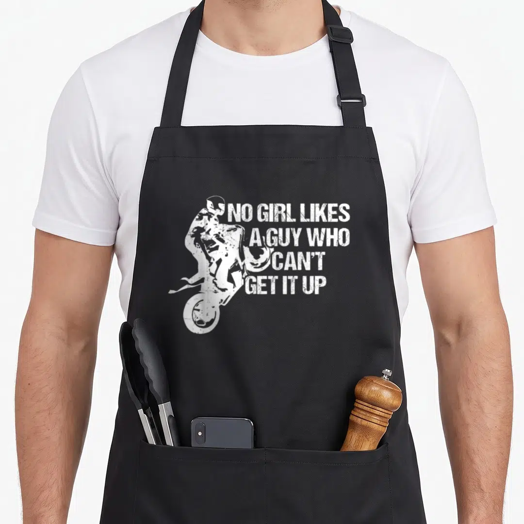 Motorcycle apron for women - White distressed motocross rider wheelie with four-line pun text — shown on a black cotton canvas apron against a white background