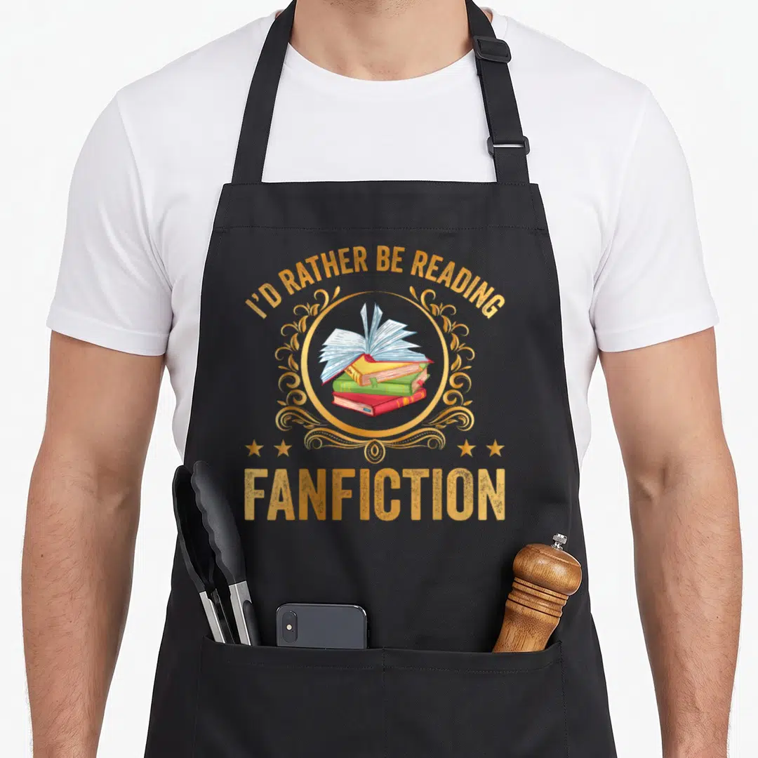 Rather i love fiction apron - Stack of blue red and green books inside gold frame with I'D RATHER BE READING FANFICTION — shown on a black cotton canvas apron against a white background