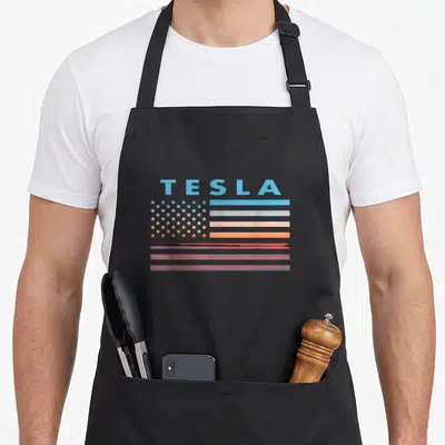 Tesla american flag apron - Stylized flag with sunset stripes and TESLA text representing West Virginia town — shown on a black cotton canvas apron against a white background