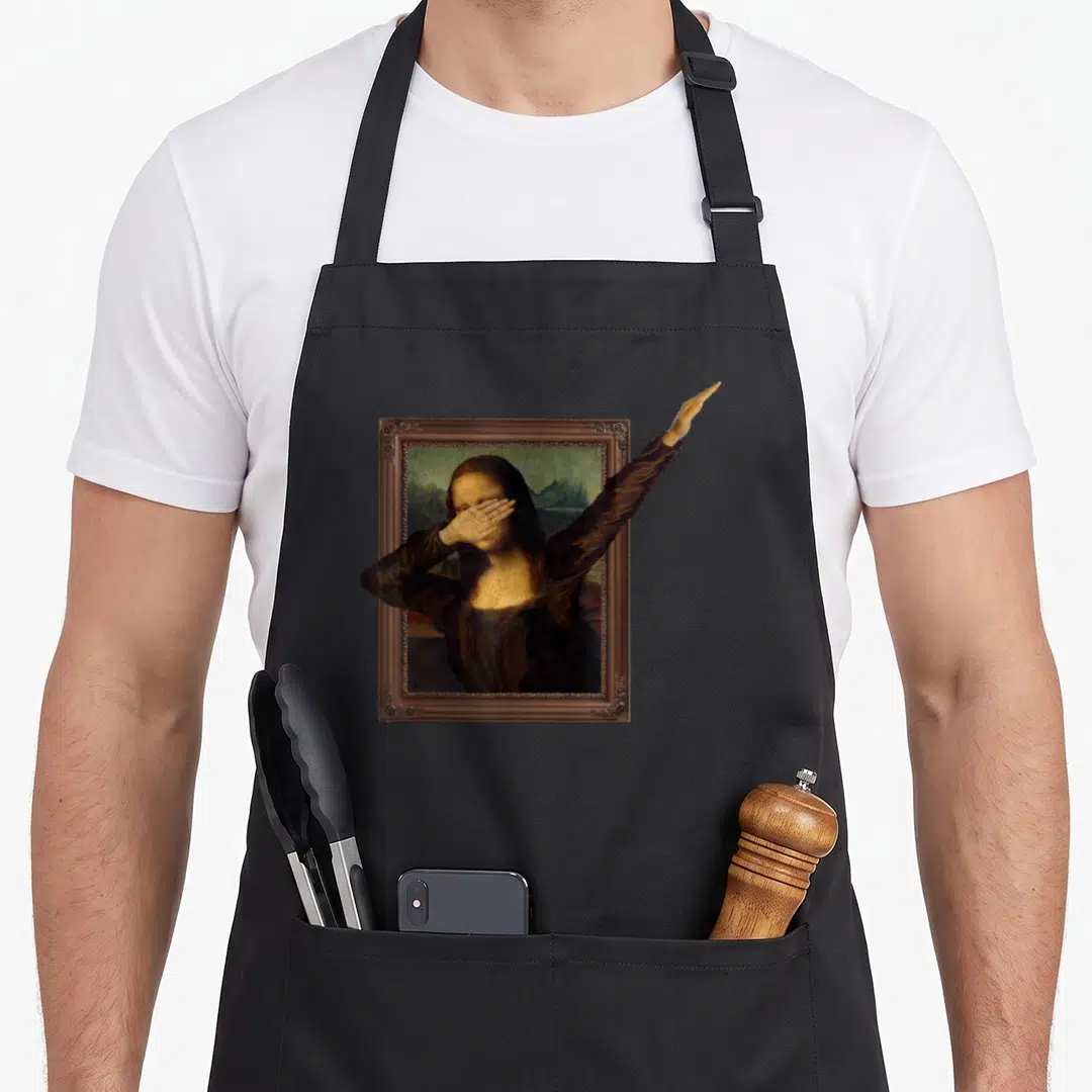 Dabbing mona lisa apron - Realistic painting of Mona Lisa in brown frame with left arm extending outside right edge — shown on a black cotton canvas apron against a white background