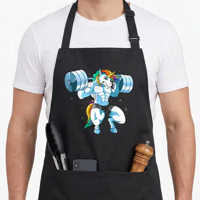 Weightlifing unicorn apron - Muscular blue cartoon unicorn lifting a barbell in black shorts on grey background — shown on a black cotton canvas apron against a white background
