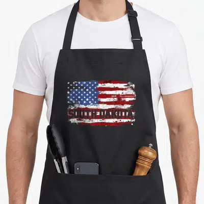 South dakota apron - Distressed USA flag with SOUTH DAKOTA text in red, white, and blue block letters — shown on a black cotton canvas apron against a white background