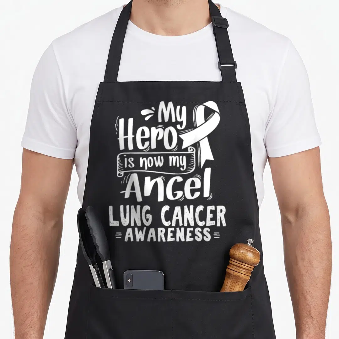 Nsclc lung cancer awareness apron - White My Hero is now my Angel text and ribbon on black bib — shown on a black cotton canvas apron against a white background