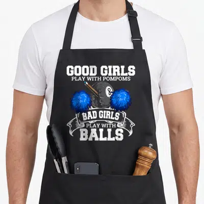Player pool apron - 8-ball flanked by blue pompoms with Good Girls Play With Pompoms Bad Girls Play With Balls text — shown on a black cotton canvas apron against a white background