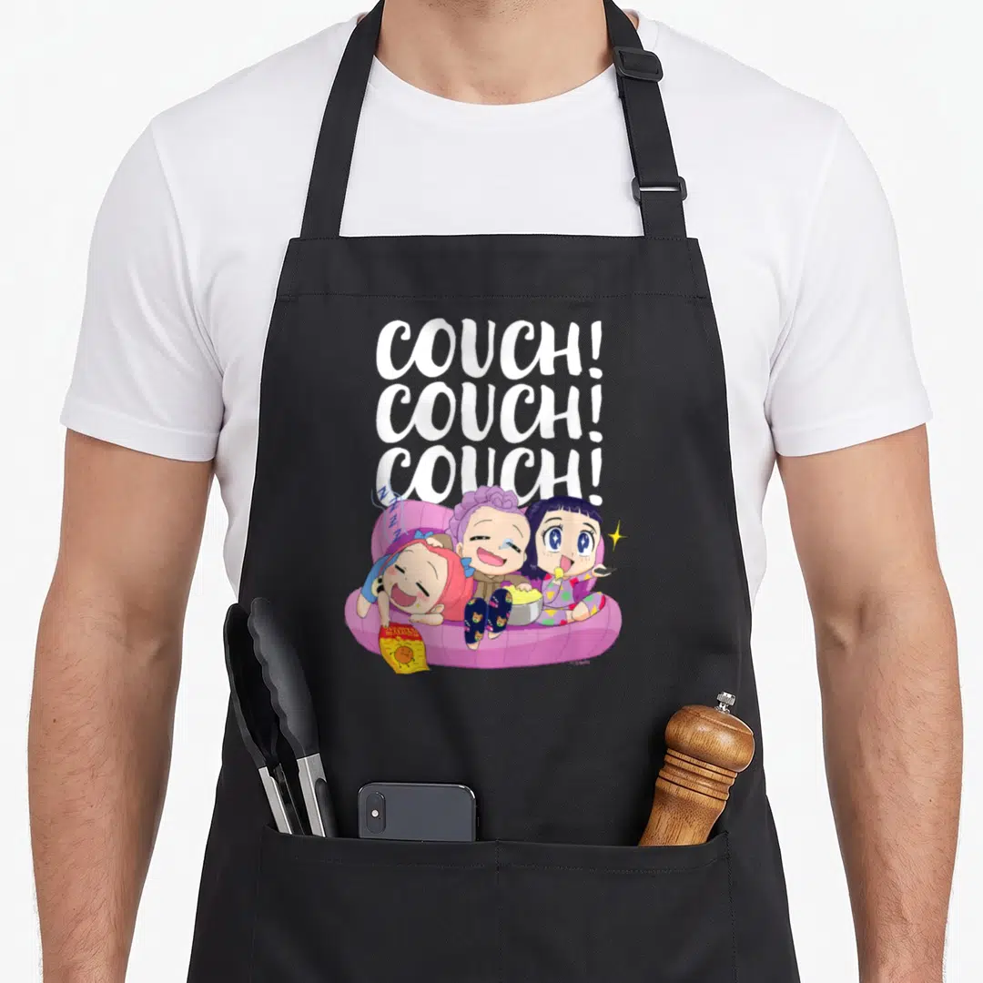 Funny couch apron - Three cartoon people on a pink couch under stacked white COUCH text holding snacks — shown on a black cotton canvas apron against a white background