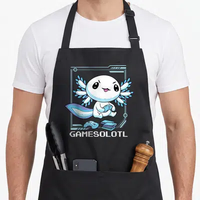 Axolotl gaming apron - Cartoon white axolotl holding controller inside blue frame with GAMESOLOTL text — shown on a black cotton canvas apron against a white background