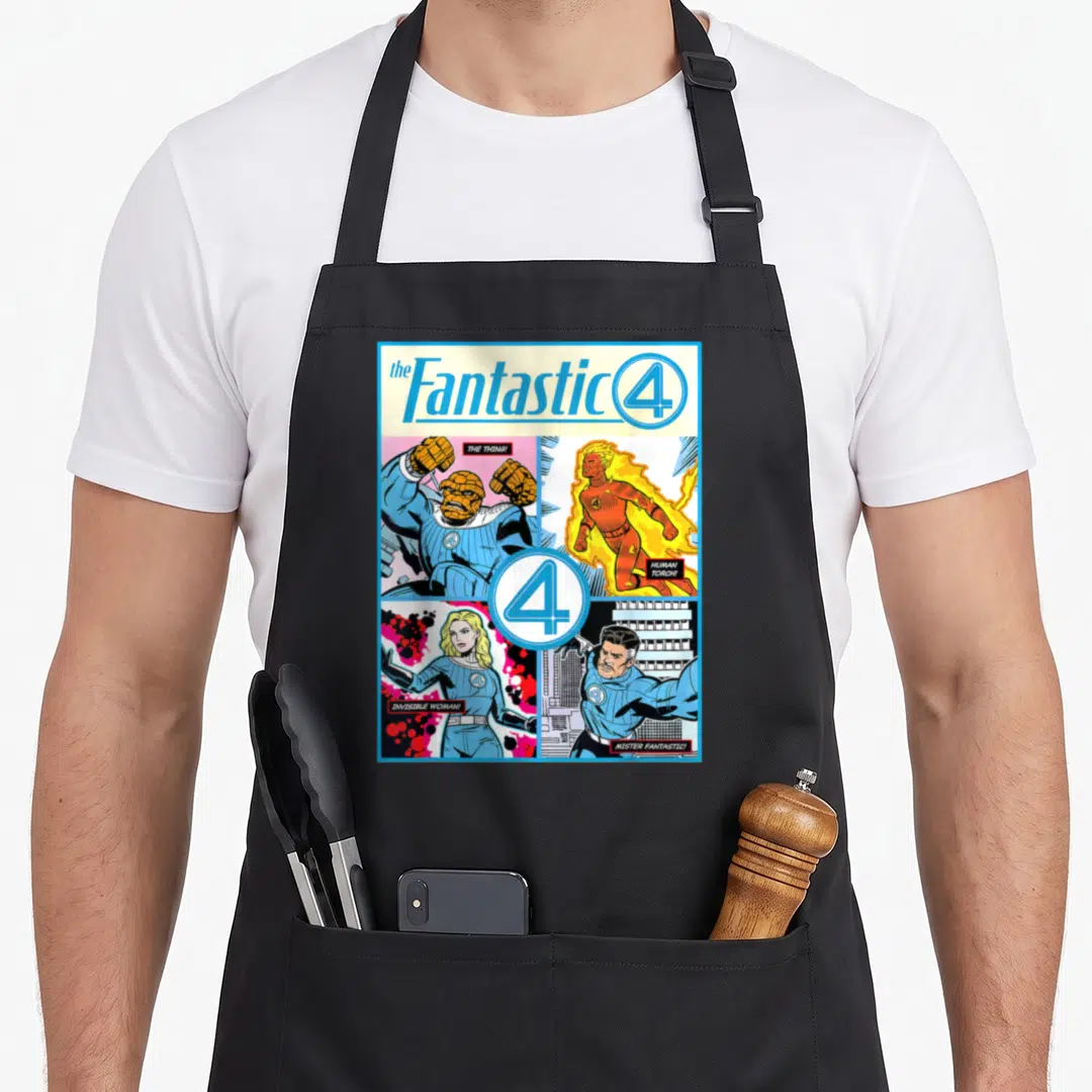 Cover first steps apron - Retro Fantastic Four comic cover print with four character panels and blue orange yellow — shown on a black cotton canvas apron against a white background