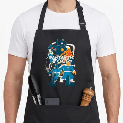 Galactus step apron - Retro Fantastic Four graphic in blue, orange, white with large shadow silhouette and title text — shown on a black cotton canvas apron against a white background