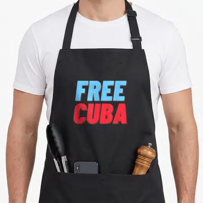 Cuba patriotic apron - Stacked free cuba text in light blue and red block letters — shown on a black cotton canvas apron against a white background