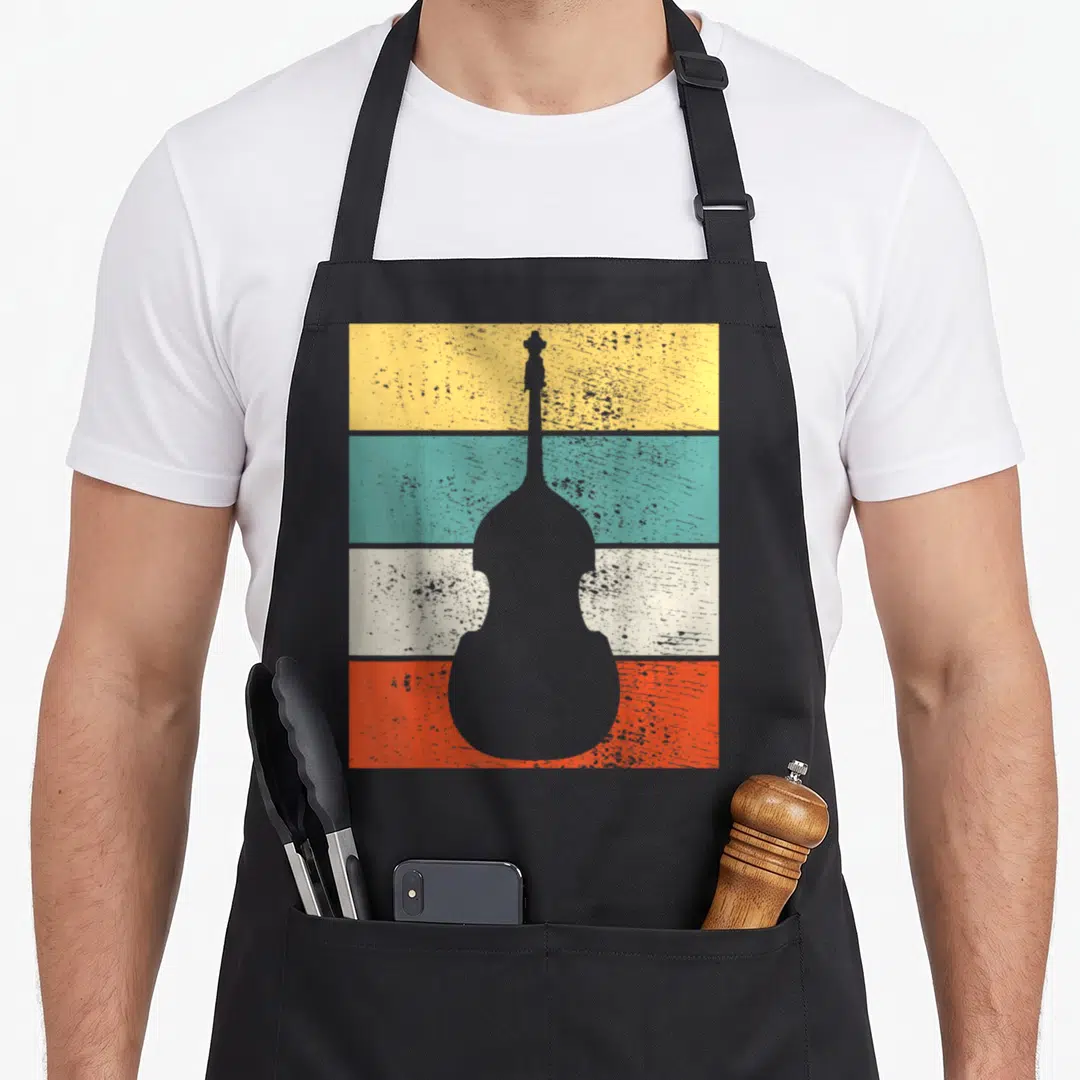 Double music teacher apron - Grey double bass silhouette over yellow teal white and orange horizontal stripes — shown on a black cotton canvas apron against a white background