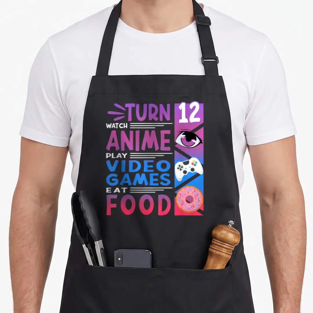 12th anime mom apron - Stacked text TURN 12 WATCH ANIME PLAY VIDEO GAMES EAT FOOD with eye controller and donut icons — shown on a black cotton canvas apron against a white background