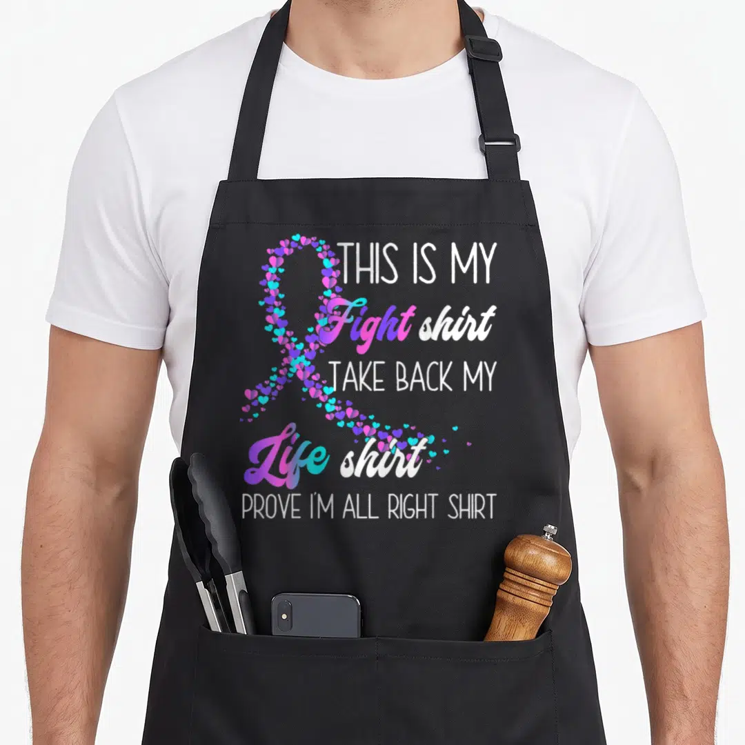 Fight thyroid ribbon apron - Heart ribbon in purple blue cyan next to stacked text This Is My Fight Take Back My Life — shown on a black cotton canvas apron against a white background