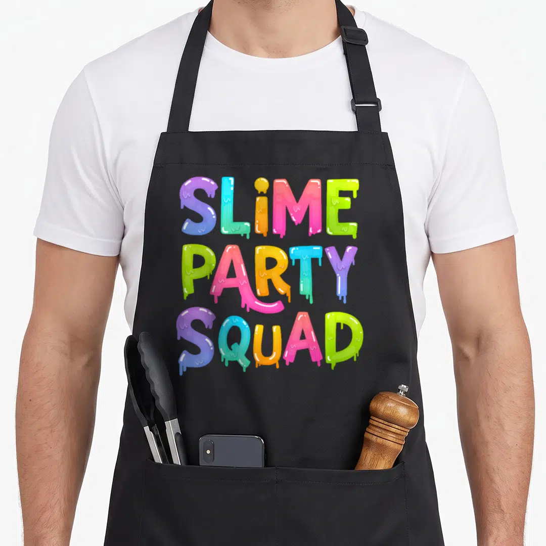 Slime birthday apron - Dripping multicolor typography reading SLIME PARTY SQUAD stacked vertically — shown on a black cotton canvas apron against a white background