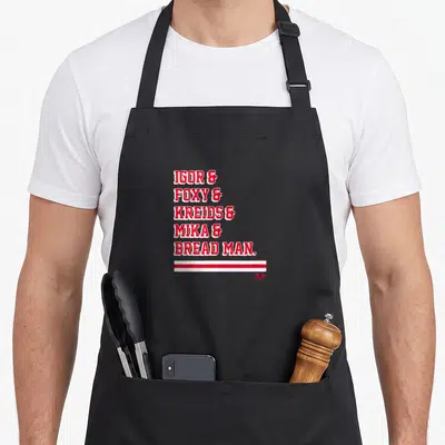 Igor bread apron - Red stacked text reading Igor Foxy Kreids Mika Bread Man above two horizontal stripes — shown on a black cotton canvas apron against a white background
