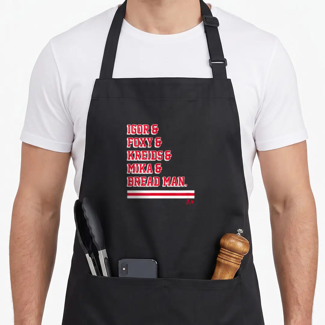 Igor bread apron - Red stacked text reading Igor Foxy Kreids Mika Bread Man above two horizontal stripes — shown on a black cotton canvas apron against a white background