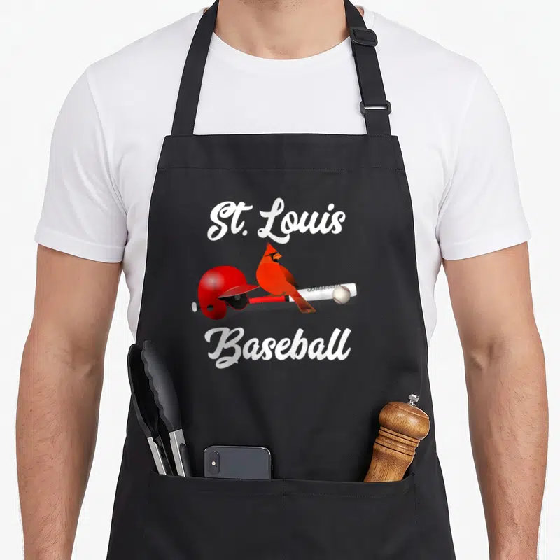 Cute louis baseball apron - Red cardinal on white bat with helmet and ball under St. Louis Baseball text — shown on a black cotton canvas apron against a white background