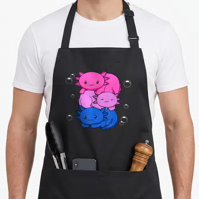 Bisexual kawaii apron - Three cartoon axolotls stacked vertically in pink, purple, and blue with white bubbles — shown on a black cotton canvas apron against a white background