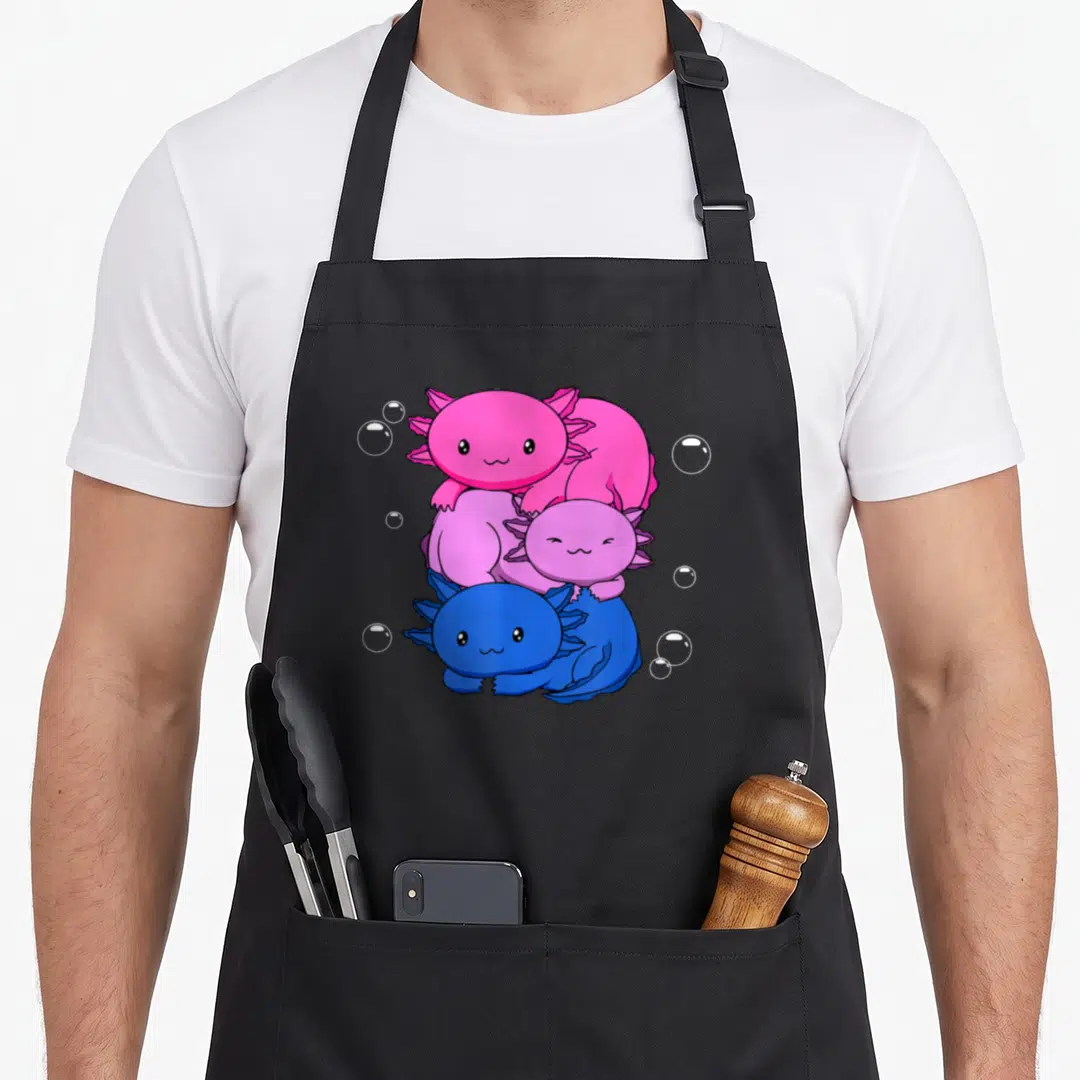 Bisexual kawaii apron - Three cartoon axolotls stacked vertically in pink, purple, and blue with white bubbles — shown on a black cotton canvas apron against a white background