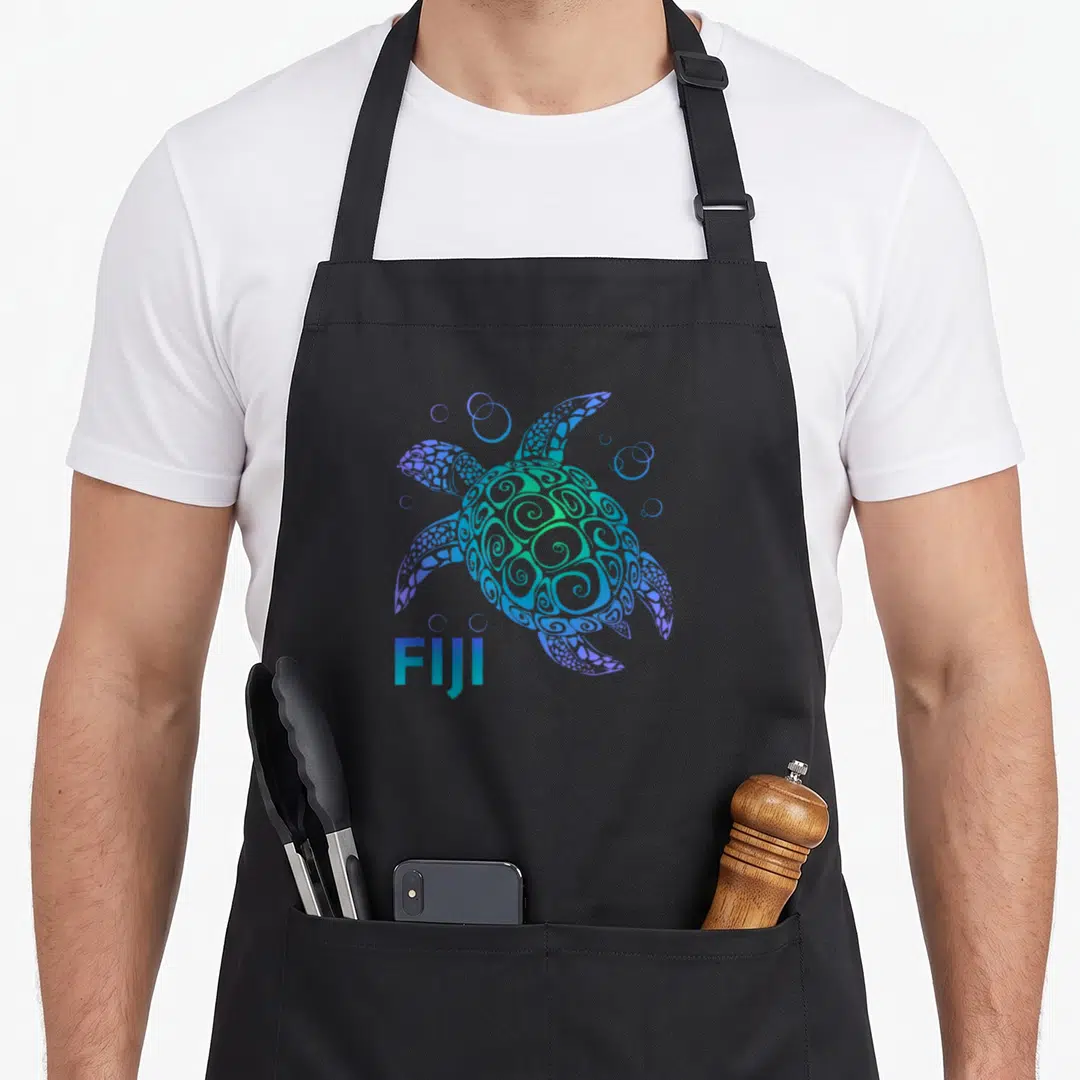 Polynesian fiji apron - Stylized tribal sea turtle in blue and purple with FIJI text — shown on a black cotton canvas apron against a white background