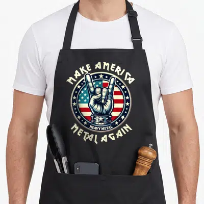 Thrash heavy metal apron - Rock hand gesture inside circle with USA flag background and arched text — shown on a black cotton canvas apron against a white background