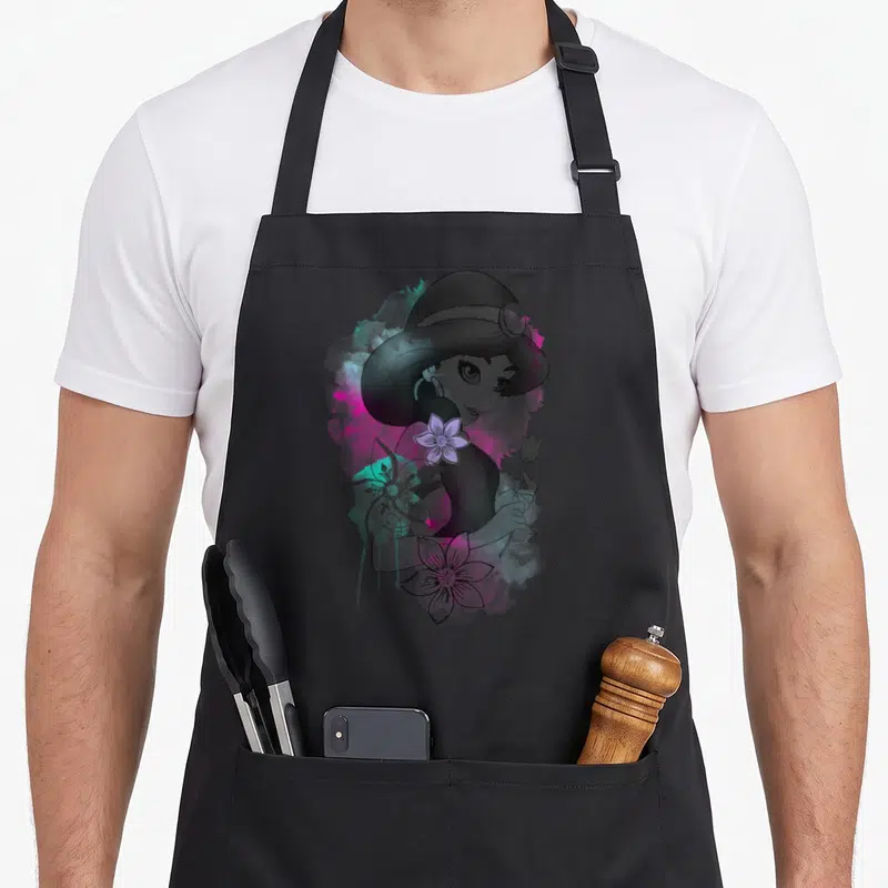 Jasmine floral apron - Watercolor portrait of a woman with three flowers and teal purple splashes — shown on a black cotton canvas apron against a white background