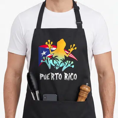 Distressed puerto frog aprons - Gradient frog silhouette over waving flag with palm trees and distressed PUERTO RICO — shown on a black cotton canvas apron against a white background