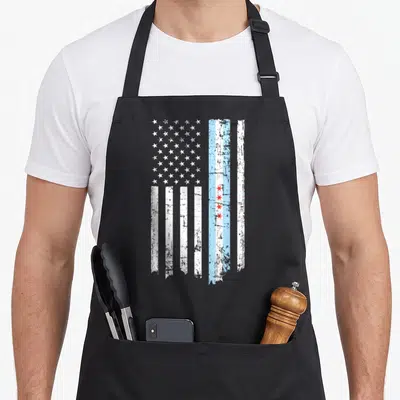 Threadrock american flag apron - Distressed vertical flag with white stars and Chicago red stars in blue and white — shown on a black cotton canvas apron against a white background