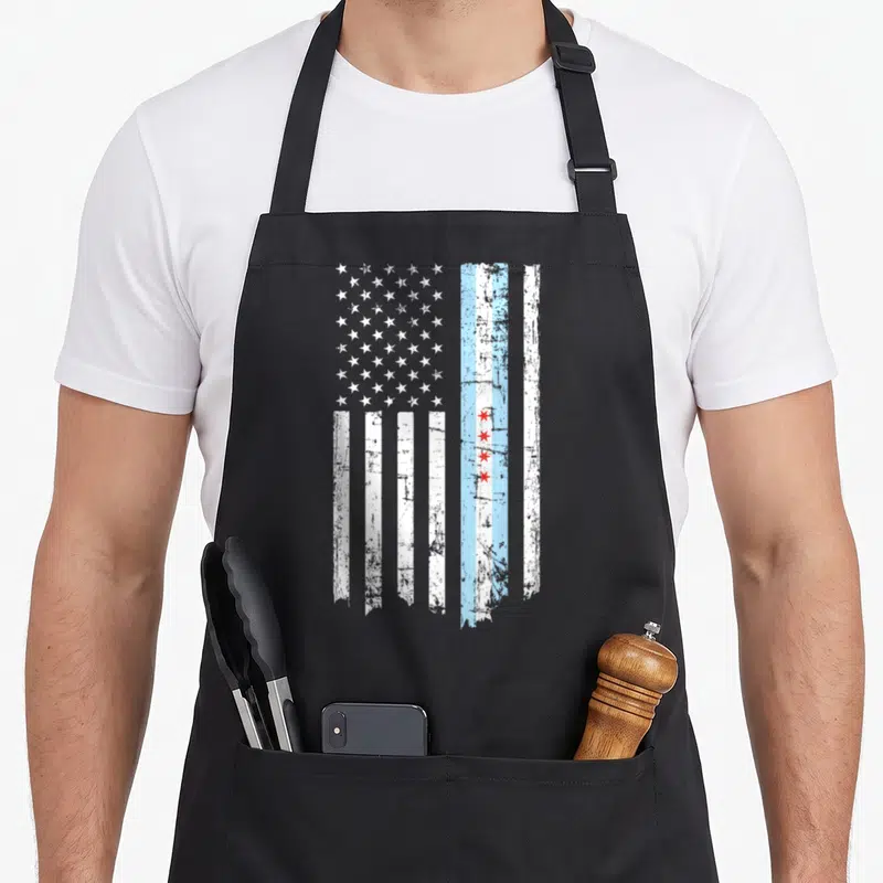 Threadrock american flag apron - Distressed vertical flag with white stars and Chicago red stars in blue and white — shown on a black cotton canvas apron against a white background