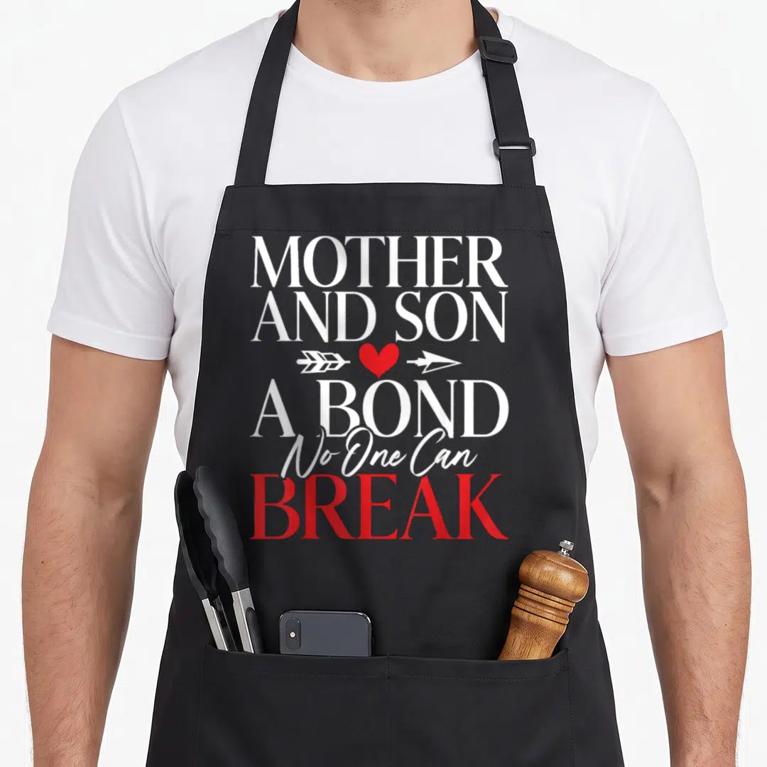 Bond mother son aprons - MOTHER AND SON A BOND No One Can BREAK text with red heart and white arrow — shown on a black cotton canvas apron against a white background