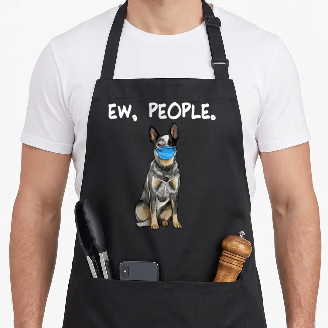 Face dog kitchen apron - Realistic dog wearing blue mask under ew people text — shown on a black cotton canvas apron against a white background