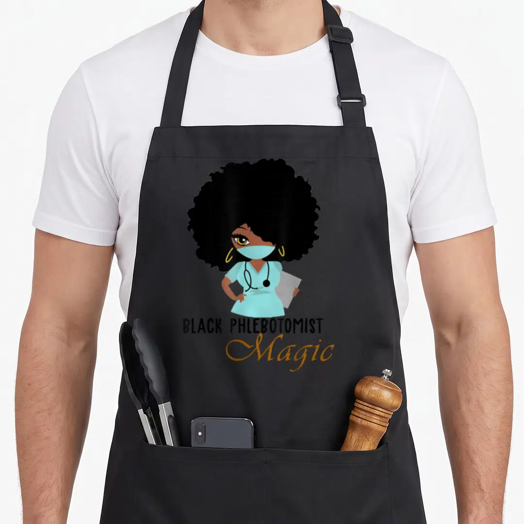 Phlebotomist magic apron - Cartoon woman in blue scrubs and mask with text BLACK PHLEBOTOMIST Magic below — shown on a black cotton canvas apron against a white background