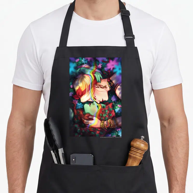 Pride vehicle apron - Two women face-to-face with rainbow arc and purple, blue, green, pink flowers — shown on a black cotton canvas apron against a white background