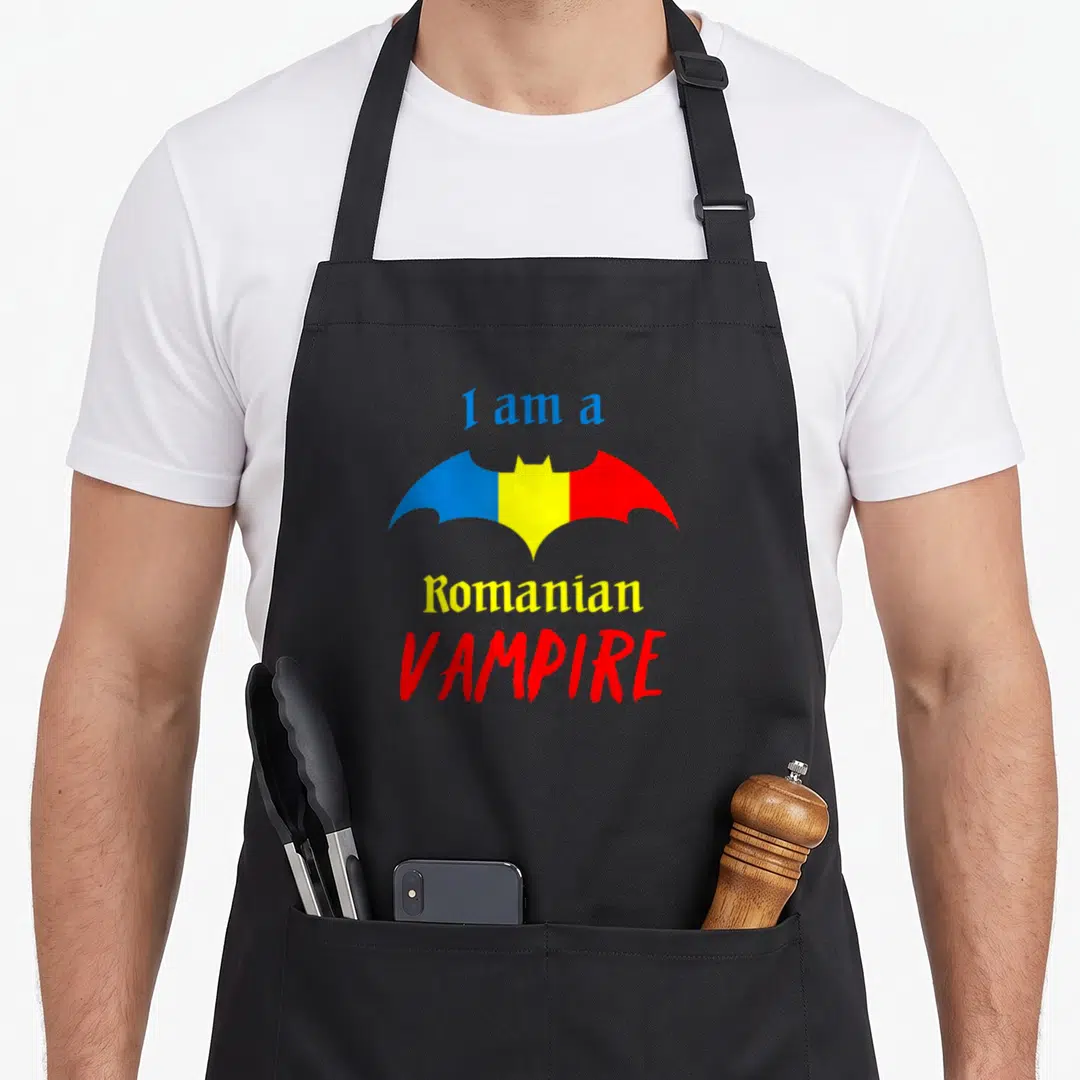 Patriotic romanian apron - Bat in blue yellow red stripes with text I am a Romanian VAMPIRE — shown on a black cotton canvas apron against a white background