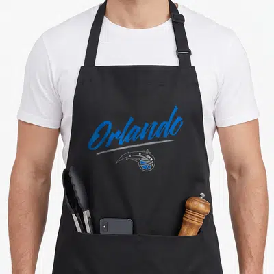 Marker magic apron - Blue Orlando script text above grey line and basketball logo with stars and swoosh — shown on a black cotton canvas apron against a white background