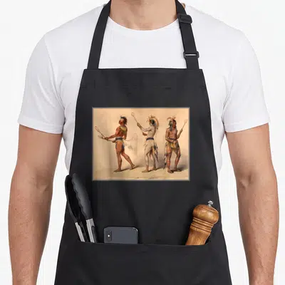 Lacrosse canadian aprons - Three Native American lacrosse players in tan and red standing side-by-side holding sticks — shown on a black cotton canvas apron against a white background