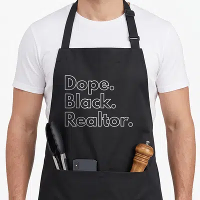 Dope realtor apron - White outline text Dope Black Realtor stacked vertically — shown on a black cotton canvas apron against a white background